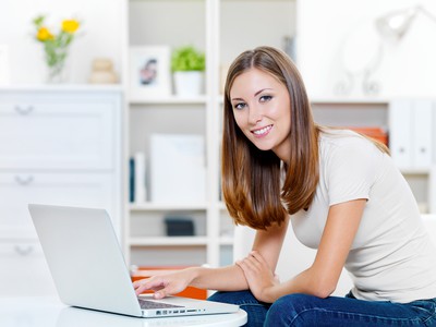 Beautiful smiling woman with laptop