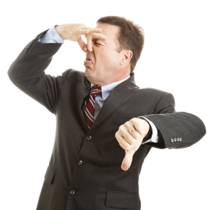 Man holding his nose, a perfect image of what a stinking deal Niche Profit Classroom is. 